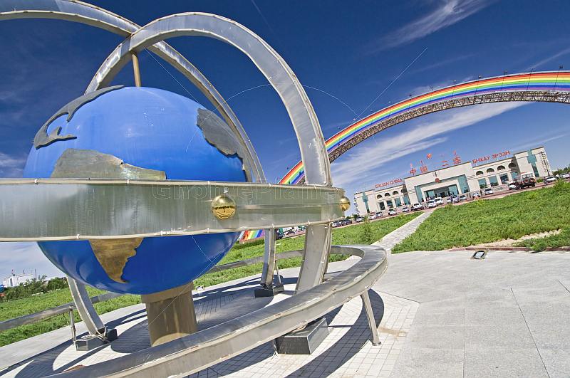 Globe and rainbow arch greet the visitor arriving at the Erlian Border Crossing post.