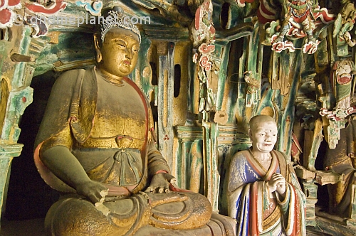 Buddhist and Bodhisattva statues in Hanging Monastery interior.