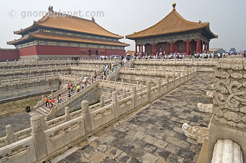 Chinese tourists climb the stairs to the Hall of Preserving Harmony in the Forbidden City.