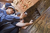 Chinese tourists visit the Yungang Buddhist caves.