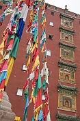 Putuozongcheng Buddhist Temple exterior with prayer flags.