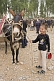 Image of Smiling boy with his mule at the Sunday Market.