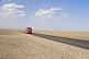 Red Chinese truck crossing the Turpan Depression.