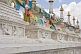 Image of White marble Buddhist stupas draped with prayer flags, at the Dazhao Lamasery.