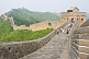Western and Chinese visitors walk along the Great Wall of China.