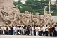 Image of War Memorial, and crowds waiting in Tiananmen Square to see the corpse of Mao Tsedong in the Chairman Mao Memorial Hall.