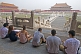 Image of A group of Chinese art students draw tourists at the Hall of Supreme Harmony in the Forbidden City.