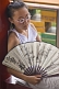 Image of Chinese girl with white paper fan in Jingshan Park.