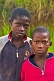Portrait of two Congolese boys with background of tall grass.