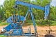A nodding-donkey pumpjack extracts crude oil from the ground.
