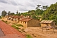 Image of A small roadside village of mud-brick houses.