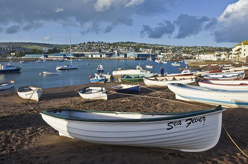 Fishing boats in Teignmouth harbor and the River Teign estuary.