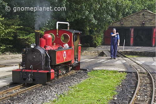 Steam locomotive driver walks towards engine Fox at Kirklees Light Railway at Clayton West.
