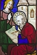 Image of Stained glass of seated Apostle writing in All Saints Church at Thirkleby.