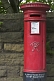 Red pillar mail Victorian post box made by Andrew Handyside and Company iron foundry in Derby.