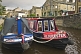 Image of Narrow boats on the Leeds and Liverpool Canal at the Belmont Street Wharf.