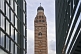 Tower of Westminster Cathedral framed by office buildings on Victoria Street.