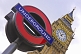 Image of London Underground tube sign outside Big Ben clock tower and Houses of Parliament.