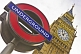 Image of London Underground tube sign outside Big Ben clock tower and Houses of Parliament.